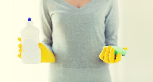 Local short-let cleaner working in a Twickenham apartment kitchen